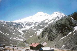 A view of the snow-clad Rohtang from Madhi