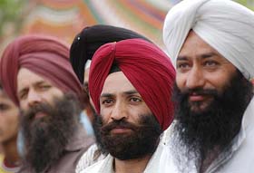 Sikh supporters listen to the speech of the Jammu and Kashmir Chief Minister, Mufti Mohammad Sayeed, during the foundation stone laying ceremony of a Tourist Complex