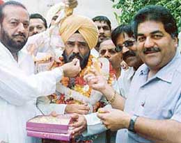 Newly appointed PPCC President Shamsher Singh Dullo being honoured by Bairagi Mahamandal members in Ludhiana .