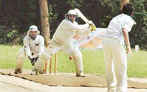 Bhuvnesh of Jai Bhawani XI in action during the final of the second Bholan Devi Memorial Cricket Tournament played here at PAU school ground on Sunday.