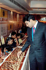 Viswanathan Anand plays rapid chess with children during a competition in Chennai on Saturday.