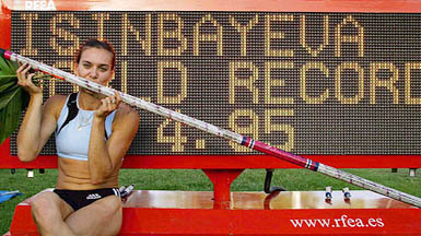 Russias Yelena Isinbayeva sits in front of the scoreboard after setting a new womens pole vault world record at the IAAF Super Grand Prix athletics meet in Madrid on Saturday. Isinbayeva cleared 4.95 metres to break her record of 4.93 metres.
