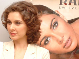 Lisa Ray, brand ambassador of Rado watches, poses for photographers on her first visit to a local showroom for a signature campaign in Amritsar on Monday. She was accompanied by Mr Christian Leiggener, Regional Sales Manager of the company.