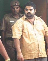 Businessman Naveen Ahuja, who killed his two children and shot his wife in Dwarka, in the custody of Delhi Police in the Capital