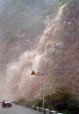 Torrents triggered by heavy rains pour down at a section