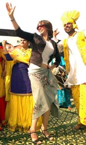Model-turned actress Lisa Ray dances with a bhangra troupe in Ludhiana on Tuesday