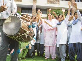 Students and the Principal of Budha Dal Public School, Dr Amrit Aujla, celebrate the victory of their school team