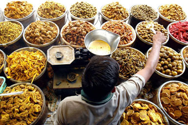 A vendor sells pickles of different varieties at a vegetable market in Amritsar on Wednesday. Making pickles is a cottage industry, which provides a source of livelihood to many unemployed persons in India.