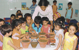Tiny tots of Everest Public Senior Secondary School celebrate Seed Germination Day here on Wednesday.