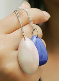 Pendants made from ashes of deceased mixed with artificial stone are displayed in Tokyo on Wednesday. The pendants  available in nine colours and priced at 1,31,000 yen ($1,176)  will keep the deceased literally close to the heart. 