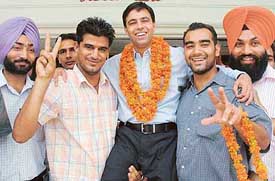 Rajwinder Singh Lucky with PU students after being declared general secretary of the Punjab Youth Congress Committee at Panjab University, Chandigarh, on Thursday. 
