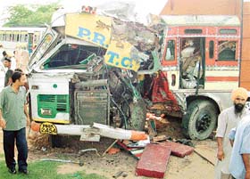 The mangled remains of a bus after it collided head-on with a truck on the Chandigarh-Zirakpur-Patiala highway in Karala village near Banur