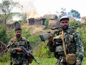 Pakistani United Nations Peacekeepers keep watch over a Rwandan rebel camp they had raided and burnt in the South Kivu province, eastern Democratic Republic of Congo