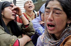 Kashmiri women cry over the death of a teenaged boy, Parvez Ahmed, in Pulwama, 30 km south of Srinagar, on Friday.