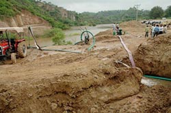 Efforts underway to drain out about 2.80 lakh cubic metres of water from an artificial lake, which was formed due to dumping of earth in a seasonal rivulet while levelling hillock in Kala Amb on Saturday. 