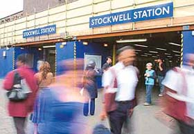 People walk past Stockwell underground station in South London