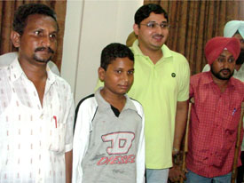 M. Anjaneyulu (left) with his son M. Anvesh Babu at Circuit House in Bathinda on Saturday. DC Rahul Bhandari and panchayat secretary Labh Singh are also seen.