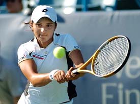 Sania Mirza returns a volley to Japans Akiko Morigami during their quarterfinal match at the Western & Southern Financial Group Womens Open in Cincinnati, USA, on Friday