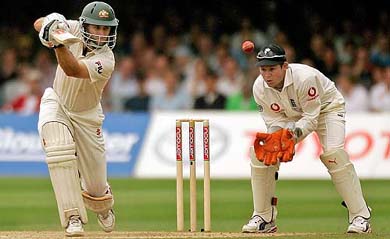 Australias Simon Katich plays a shot as Englands Geraint Jones looks on during the third day of the first Ashes Test at Lords on Saturday
