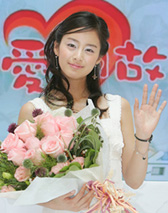 South Korean actress Kim Tae-hee waves during a promotional event for her television drama "Love Story in Harvard" at a shopping centre in Hong Kong 