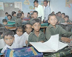 Child beggars and labourers study in a school run by Mr Mansa Ram Ahuja.