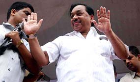 Former Chief  Minister and former Shiv Sena leader Narayan Rane greets supporters as he addresses a public rally in a Sena stronghold in south central Mumbai on Sunday afternoon.