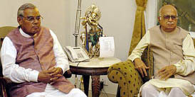 Former Prime Minister Atal Bihari Vajpayee and BJP President Lal Krishna Advani attend a meeting of the NDA in New Delhi on Sunday.