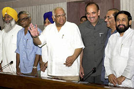 Speaker Somnath Chatterjee, Minister for Parliamentary Affairs Gulam Nabi Azad and parliamentarians from different political parties chat prior to an all-party meeting at Parliament House in New Delhi on Sunday.