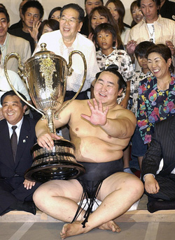 Sumo wrestling grand champion Asashoryu holds the Emperors Cup after winning a tournament at Nagoya, central Japan