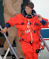 Space shuttle Discovery Commander Eileen Collins disembarks the shuttle training aircraft after performing training exercises