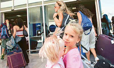 Spanish tourists walk to the airport terminal as they leave the Red Sea resort of Sharmel-Sheikh in Egypt on Sunday