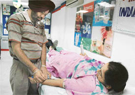 A volunteer donates blood at a camp organised jointly by the Amway Opportunity Foundation and the District Red Cross Society in Ludhiana on Monday