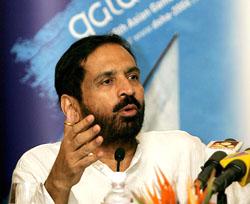 The President of the Indian Olympic Association, Suresh Kalmadi, speaks during a press conference in New Delhi on Monday