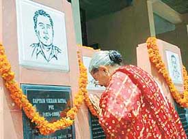 A woman pays homage to Kargil martyrs at DAV College, Sector-10, Chandigarh, on 