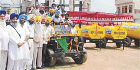 Akali leader and Kila Raipur MLA Jagdish Singh Garcha dedicates water tankers donated by councillor Simarjit Singh Bains to the public in Ludhiana
