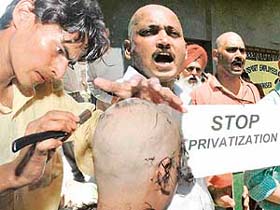 Employees of the Regional Passport Office, Sector 34, Chandigarh, tonsured their heads in protest against the privatisation of the working of the office