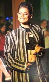 A model poses inside a nightclub during a fashion show in Kolkata on Wednesday night.