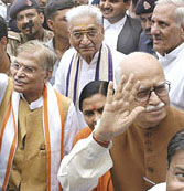 L.K. Advani, Uma Bharti and Ashok Singhal come out of the Special Court in Rae Bareli on Thursday.