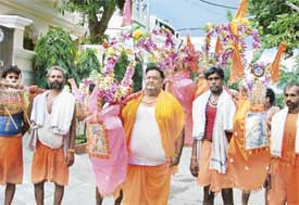 Raj Kumar Garg with a contingent of Kanwarias that reached Ludhiana on Thursday