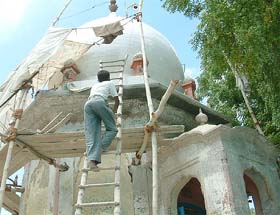Unmindful of its heritage value, bathroom tiles are being put up on the 800-year-old structure, belonging to Naath Jogis, with a view to give a modern look at Sarhali, Amritsar