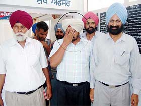 SHO Jasbir Singh in the custody of the Vigilance Bureau after being arrested for graft in Moga