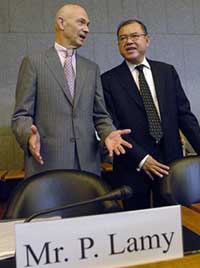 Newly-appointed Director-General of the WTO Pascal Lamy (left) of France speaks with outgoing Director-General Supachai Panitchpakdi during the opening of the General Council at the World Trade Organisation (WTO) headquarters in Geneva on Friday. Mr Lamy will assume office on September 1. 