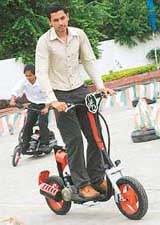 Students demonstrate prototypes of gas-powered scooters as part of the automotive manufacturing program at the Canadian Institute of International Studies in Mohali