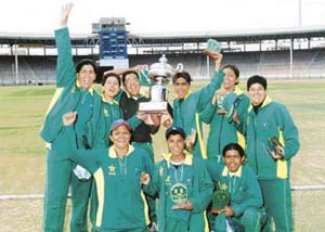 Pakistani women cricketers celebrate after winning a tournament at the Gaddafi Stadium in Lahore on May 21, 2005