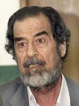 Former Iraqi President Saddam Hussein answers questions during an investigative session conducted by the Iraqi Special Tribunal (IST) in Baghdad on Friday.
