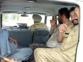 The two policemen who were thrashed by Phus Mandi village residents being taken to Bathinda
