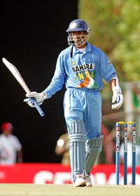 Rahul Dravid acknowledges the crowd on reaching his half century during the tri-series one-day international against Sri Lanka at Dambulla