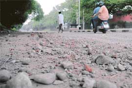 Showers left a devastating impact on city roads. This picture was taken by Tribune lensman Pradeep Tewari on the Sector 18-19 dividing road, Chandigarh, on Sunday.