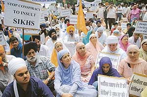 Members of Sikh organisations protest outside the Sector 34 police station, Chandigarh, on Sunday.