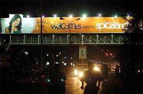 A huge, about 70-feet long, hoarding of a private telecom company, displayed across a newly constructed footbridge in violation of the orders of the Punjab and Haryana High Court